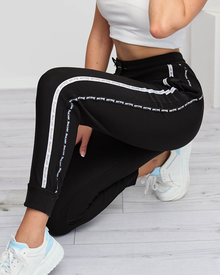 Női fekete cargo nadrág csíkokkal - Ruházat