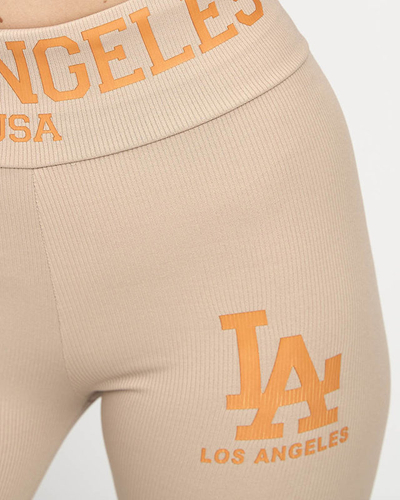 Női világosbarna bordás leggings narancssárga felirattal - Ruházat