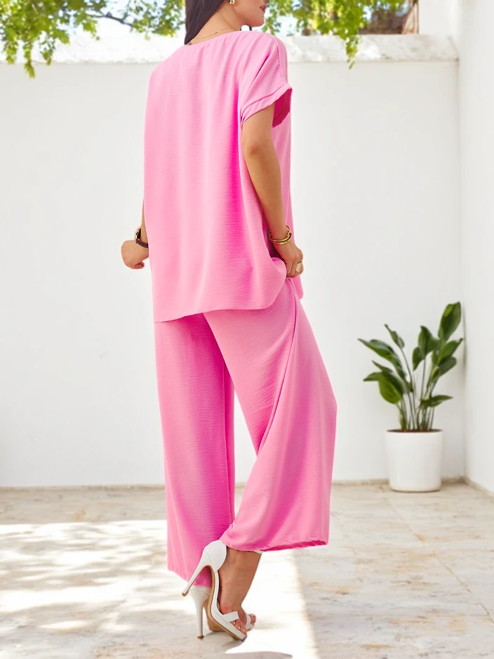 Royalfashion Női rövidujjú szett dekoratív virággal és bő nadrággal