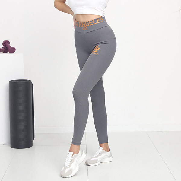 Női szürke bordás leggings narancssárga felirattal - Ruházat