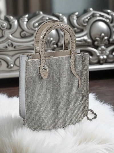 Royalfashion Női borítéktáska cirkóniákkal és kígyófogantyúkkal Snake Glam