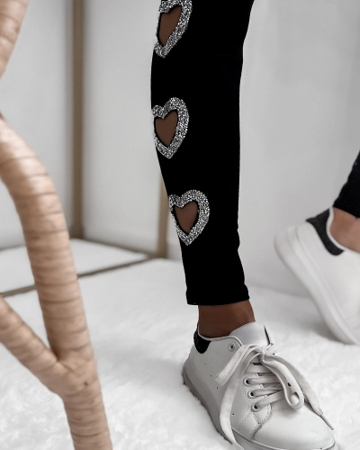 Fekete női leggings szív alakú kivágásokkal és cirkonokkal- Ruházat